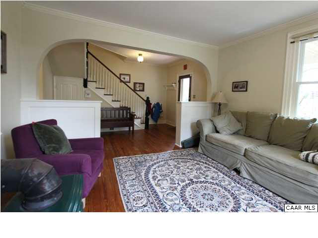 129 Goodman Street Charlottesville, VA 22902 - Photo 8 of 25 a living room with furniture and a rug