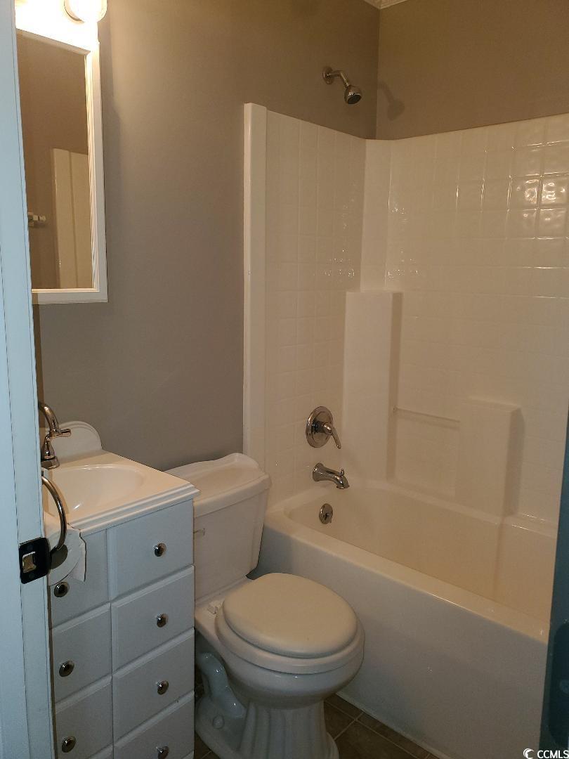 615 Burcale Rd Circle Myrtle Beach, SC 29579 - Photo 11 of 17 Bathroom featuring tile patterned floors, bathing tub / shower combination, vanity, and toilet