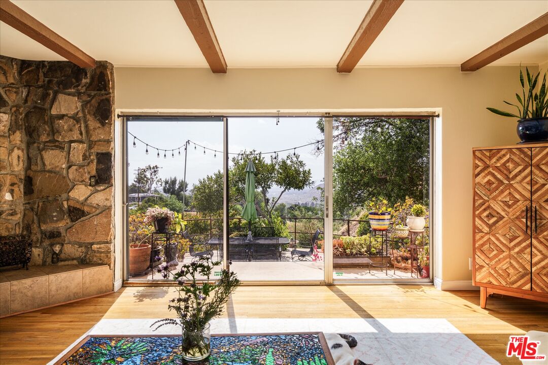 11111 Tujunga Canyon Boulevard Tujunga, CA 91042 - Photo 1 of 38 a view of a living room and a floor to ceiling window