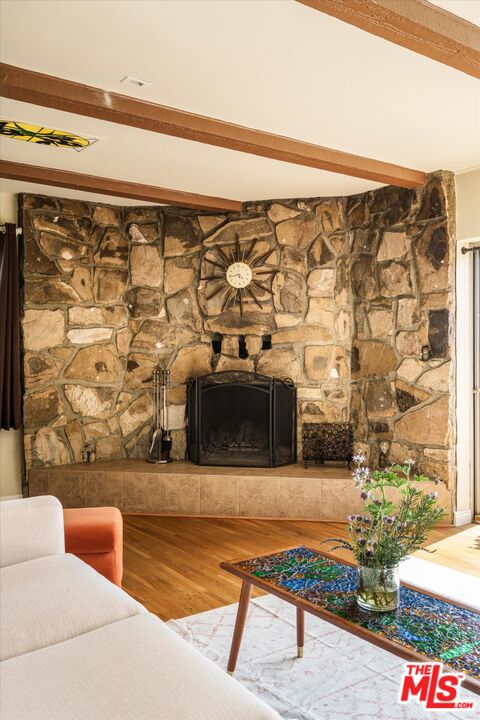 11111 Tujunga Canyon Boulevard Tujunga, CA 91042 - Photo 11 of 38 a living room with a couch and a rug