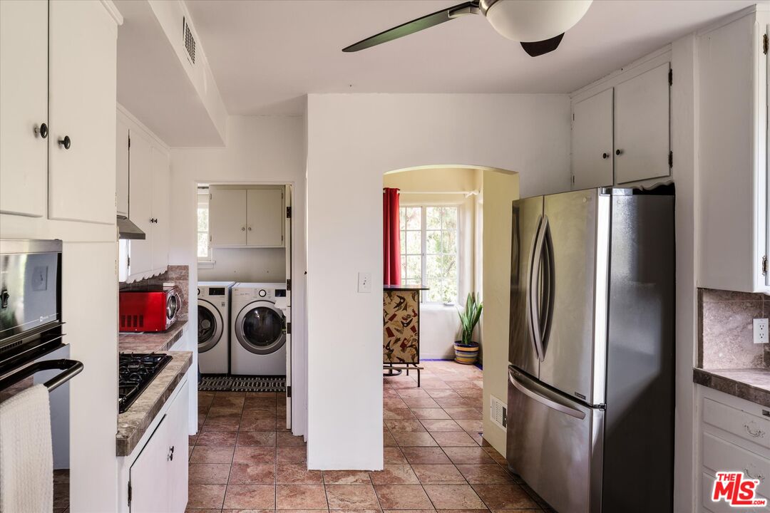 11111 Tujunga Canyon Boulevard Tujunga, CA 91042 - Photo 14 of 38 a kitchen with a refrigerator and a stove
