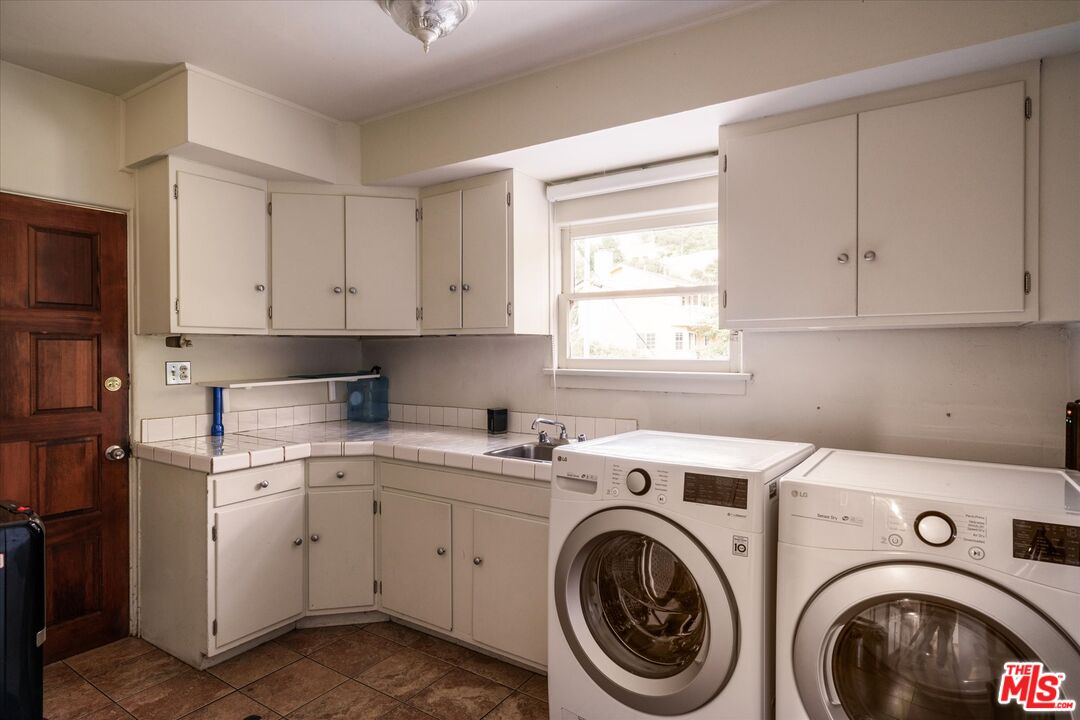 11111 Tujunga Canyon Boulevard Tujunga, CA 91042 - Photo 17 of 38 a utility room with sink dryer and washer