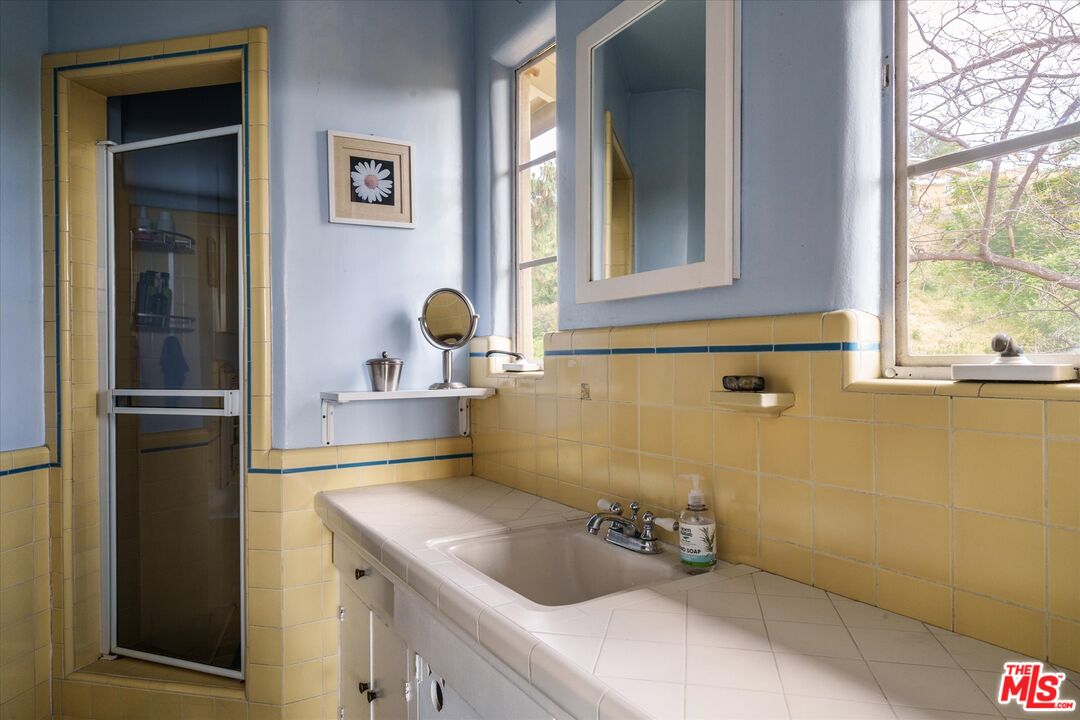 11111 Tujunga Canyon Boulevard Tujunga, CA 91042 - Photo 22 of 38 a bathroom with a sink and a window