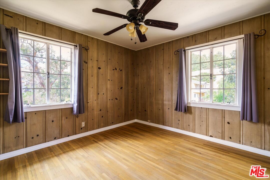 11111 Tujunga Canyon Boulevard Tujunga, CA 91042 - Photo 25 of 38 a view of a livingroom with a window and a ceiling fan