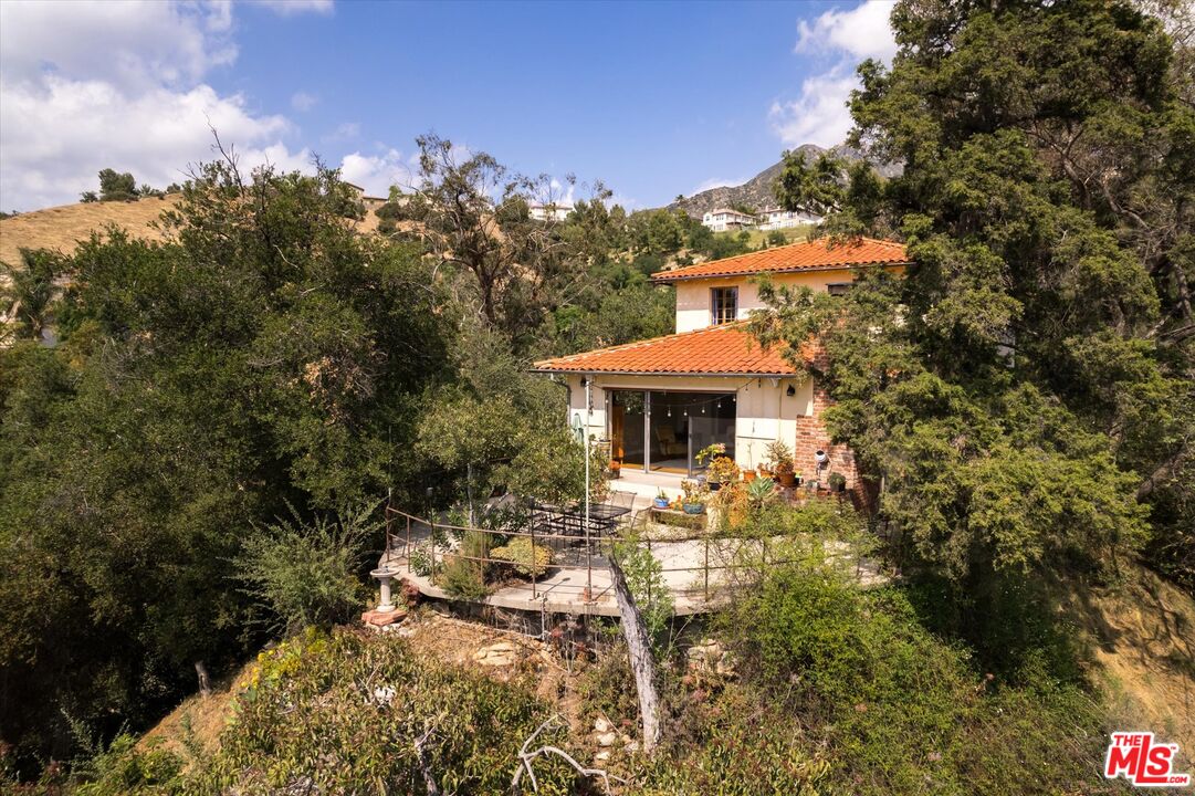 11111 Tujunga Canyon Boulevard Tujunga, CA 91042 - Photo 28 of 38 a view of a house with a yard