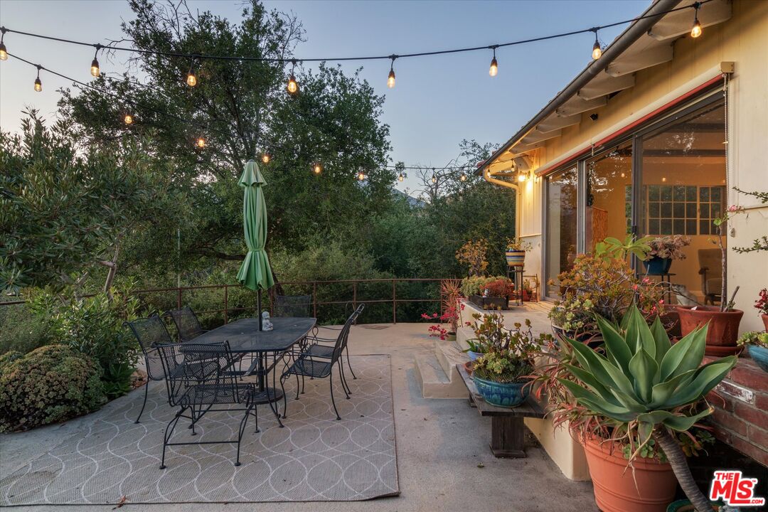 11111 Tujunga Canyon Boulevard Tujunga, CA 91042 - Photo 29 of 38 a backyard of a house with a swing table and chairs