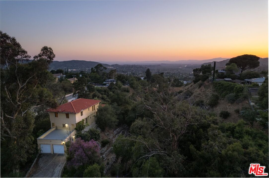 11111 Tujunga Canyon Boulevard Tujunga, CA 91042 - Photo 3 of 38 a view of a city with sunset view