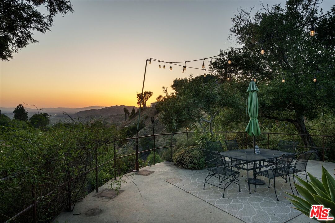 11111 Tujunga Canyon Boulevard Tujunga, CA 91042 - Photo 4 of 38 a view of a balcony with chairs and a potted plant