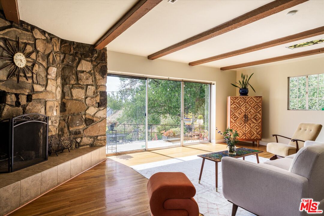 11111 Tujunga Canyon Boulevard Tujunga, CA 91042 - Photo 10 of 38 a living room with furniture and a floor to ceiling window