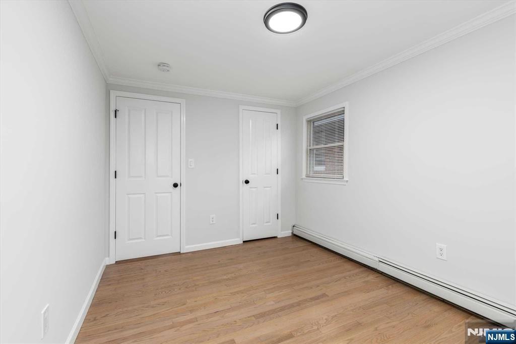 4 Coppola Street, Unit 2 Nutley, NJ 07110 - Photo 13 of 14 a view of empty room with wooden floor