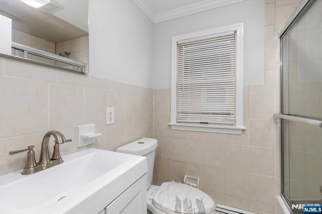 4 Coppola Street, Unit 2 Nutley, NJ 07110 - Photo 14 of 14 a bathroom with a sink a toilet and shower