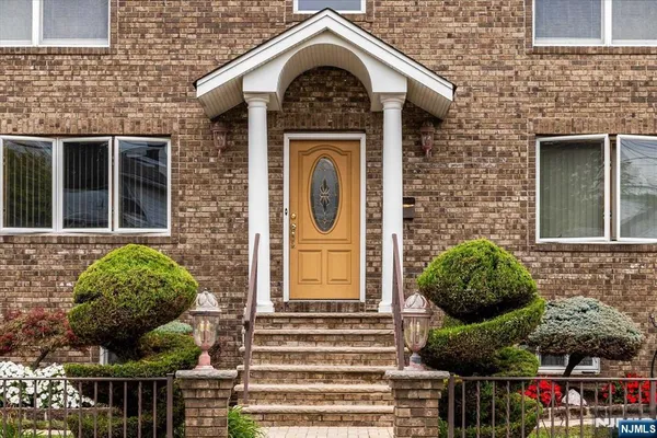 a front view of a house with outdoor space