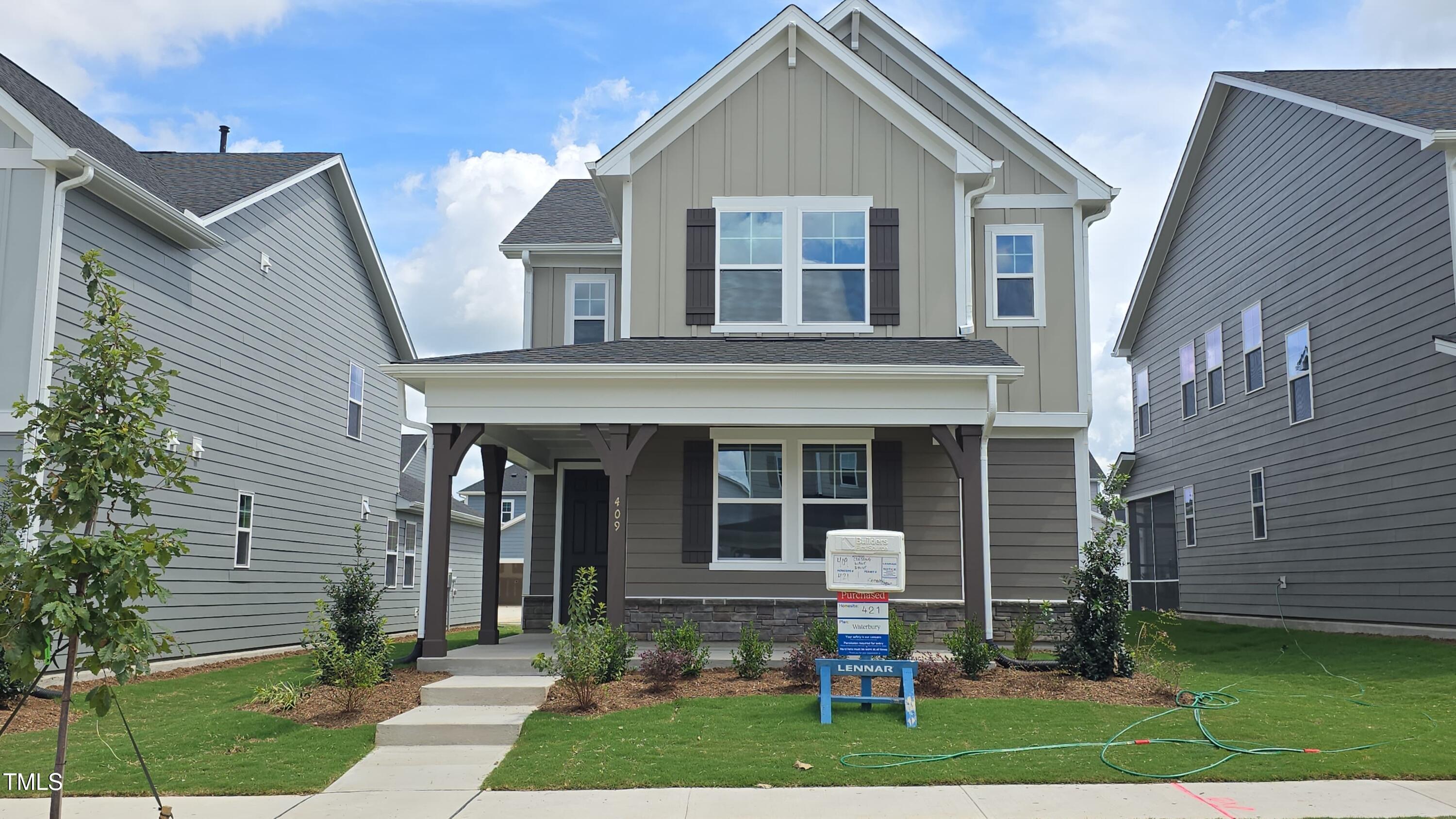 409 Cresting Wave Drive Wake Forest, NC 27587 - Photo 1 of 31 a front view of a house with a yard