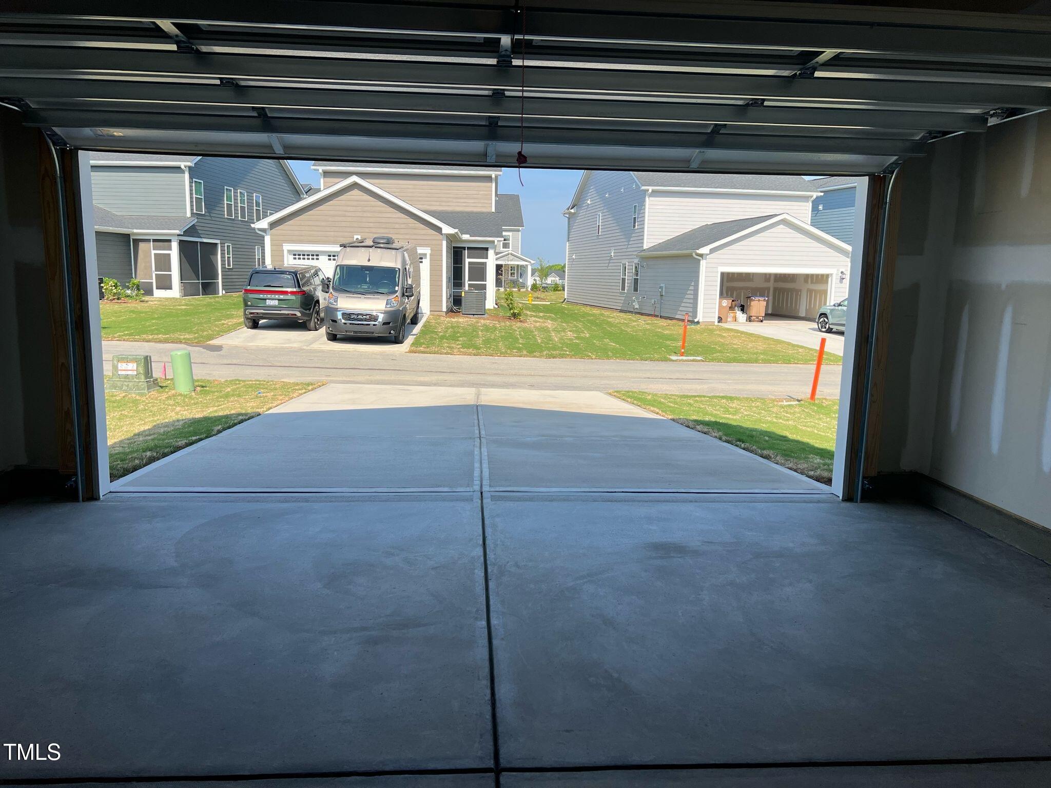 409 Cresting Wave Drive Wake Forest, NC 27587 - Photo 25 of 31 a view of garage with a tv