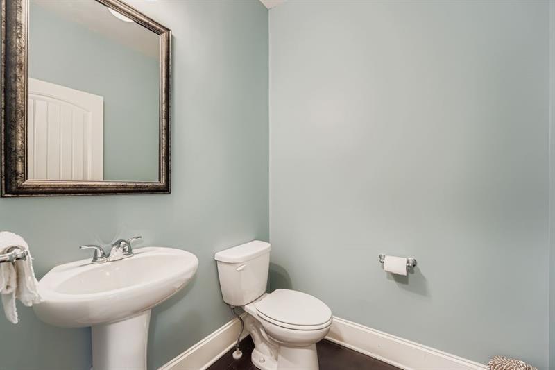 122 Prospect Lane Dallas, GA 30157 - Photo 13 of 34 a bathroom with a sink mirror and toilet