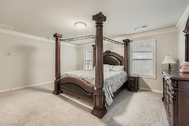 122 Prospect Lane Dallas, GA 30157 - Photo 15 of 34 a bedroom with a bed and a table in it