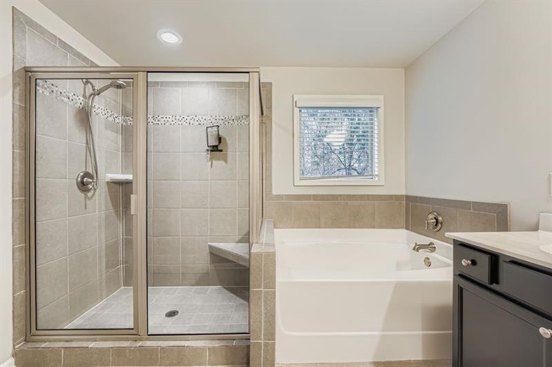 122 Prospect Lane Dallas, GA 30157 - Photo 17 of 34 a bathroom with a bathtub and a shower