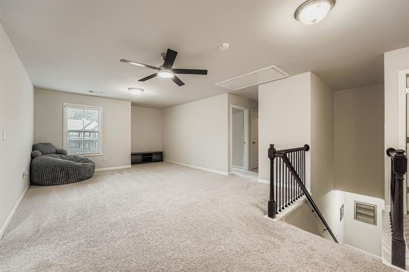122 Prospect Lane Dallas, GA 30157 - Photo 22 of 34 a living room with furniture and a ceiling fan