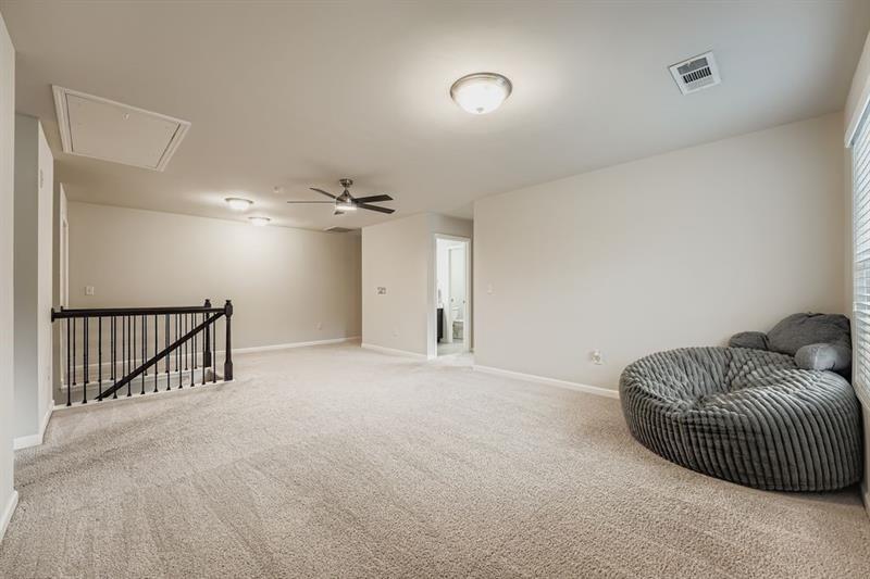 122 Prospect Lane Dallas, GA 30157 - Photo 23 of 34 a living room with furniture and a ceiling fan