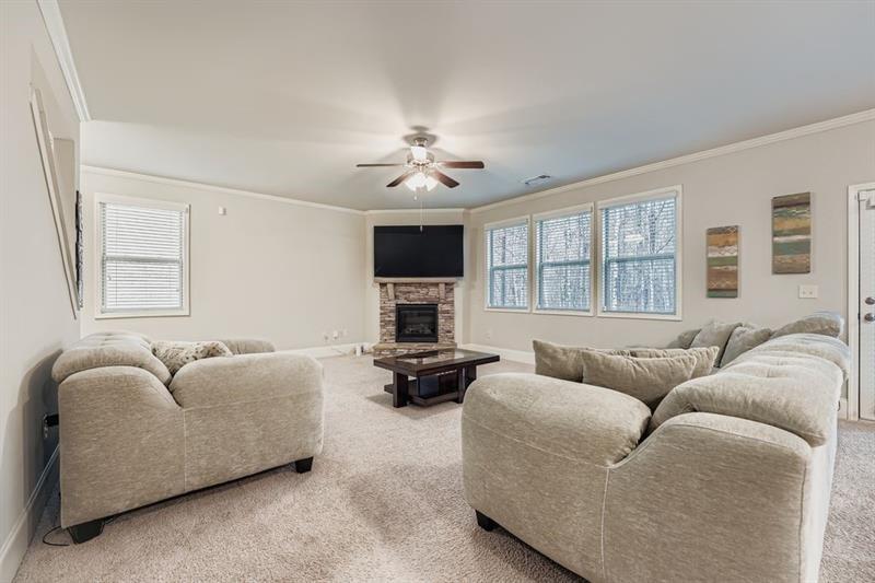 122 Prospect Lane Dallas, GA 30157 - Photo 5 of 34 a living room with furniture window and a flat screen tv
