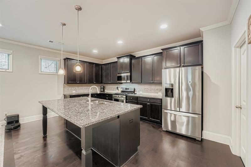 122 Prospect Lane Dallas, GA 30157 - Photo 8 of 34 a kitchen with a center island and stainless steel appliances