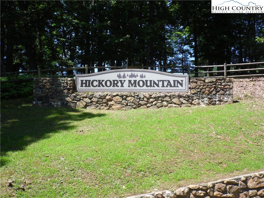 Hickory View Drive, Unit 34 Sparta, NC 28675 - Photo 2 of 12 a sign that is sitting in the grass