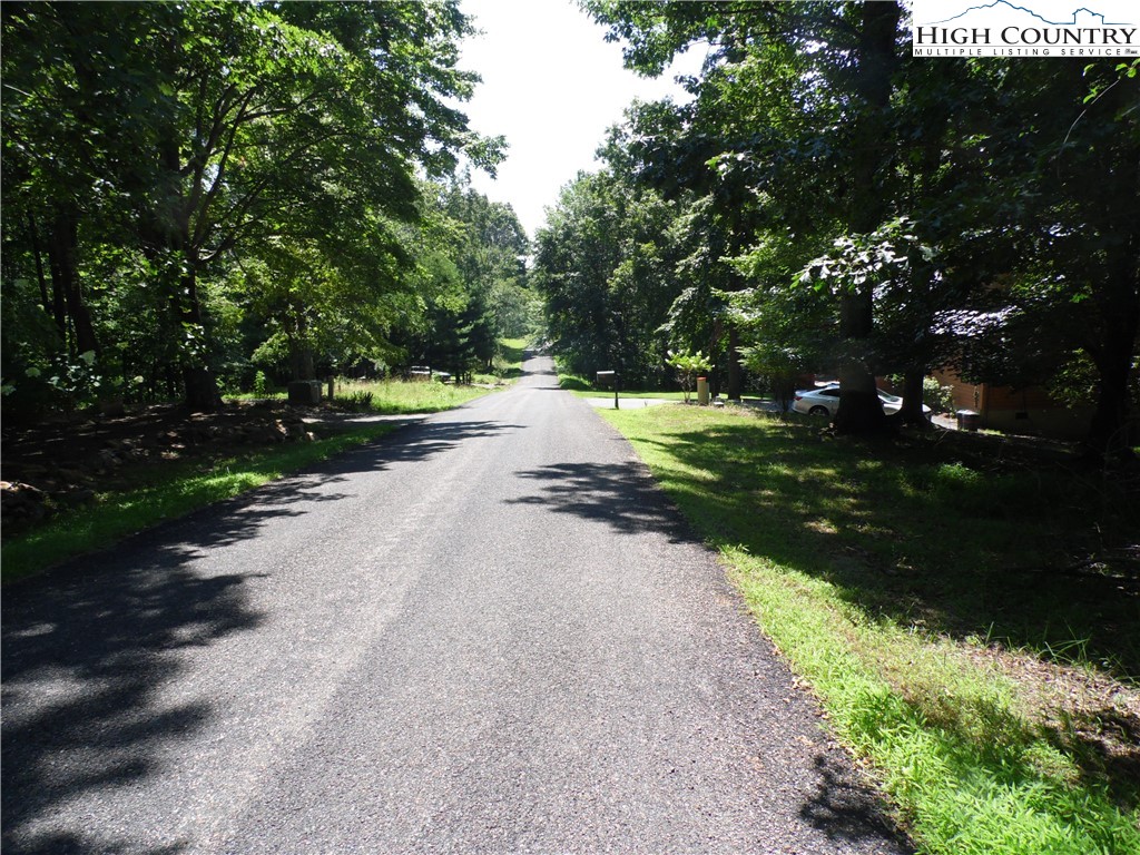 Hickory View Drive, Unit 34 Sparta, NC 28675 - Photo 5 of 12 a view of a street with a yard