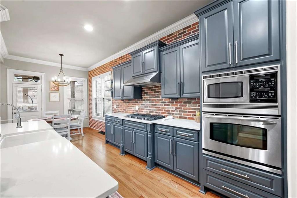 3440 Rialto Place Alpharetta, GA 30022 - Photo 13 of 66 a kitchen with stainless steel appliances granite countertop a stove a sink and a microwave