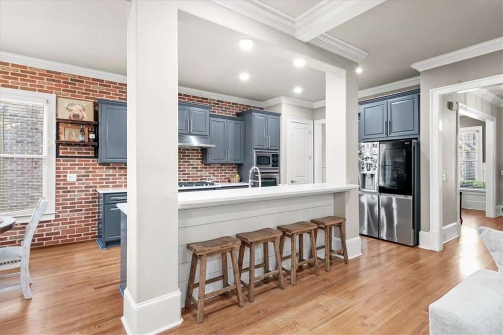 3440 Rialto Place Alpharetta, GA 30022 - Photo 16 of 66 a kitchen with stainless steel appliances granite countertop a refrigerator and a stove top oven