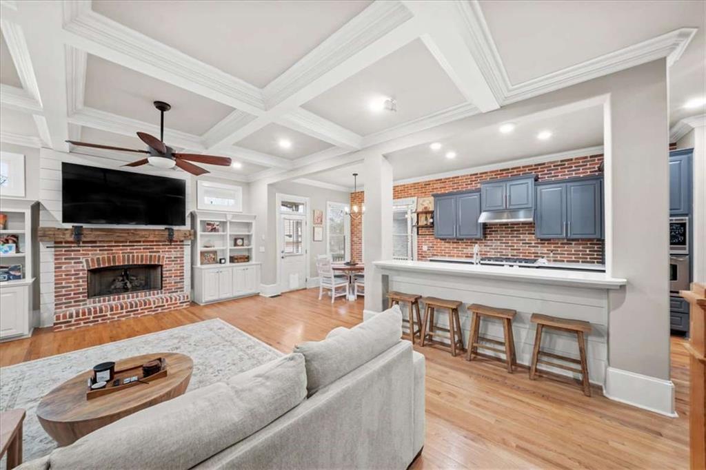 3440 Rialto Place Alpharetta, GA 30022 - Photo 20 of 66 a living room with furniture a fireplace and flat screen tv