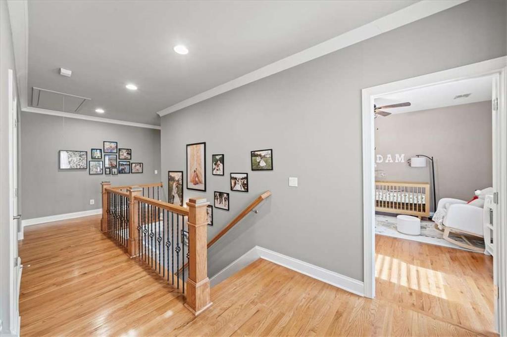 3440 Rialto Place Alpharetta, GA 30022 - Photo 27 of 66 a view of a hallway with wooden floor and windows