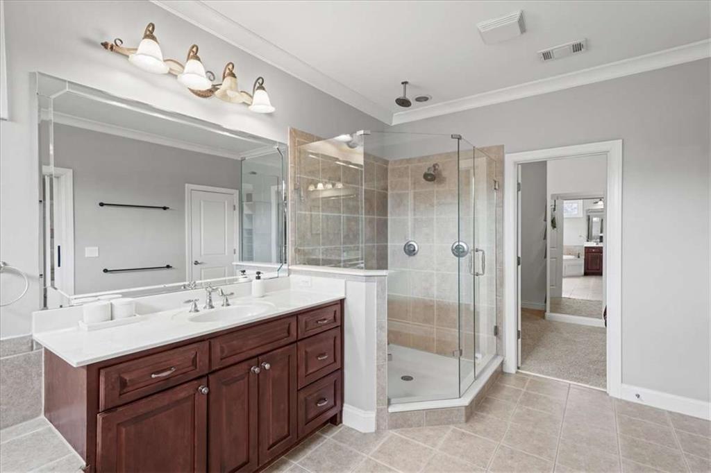 3440 Rialto Place Alpharetta, GA 30022 - Photo 36 of 66 a spacious bathroom with a shower sink double and mirror