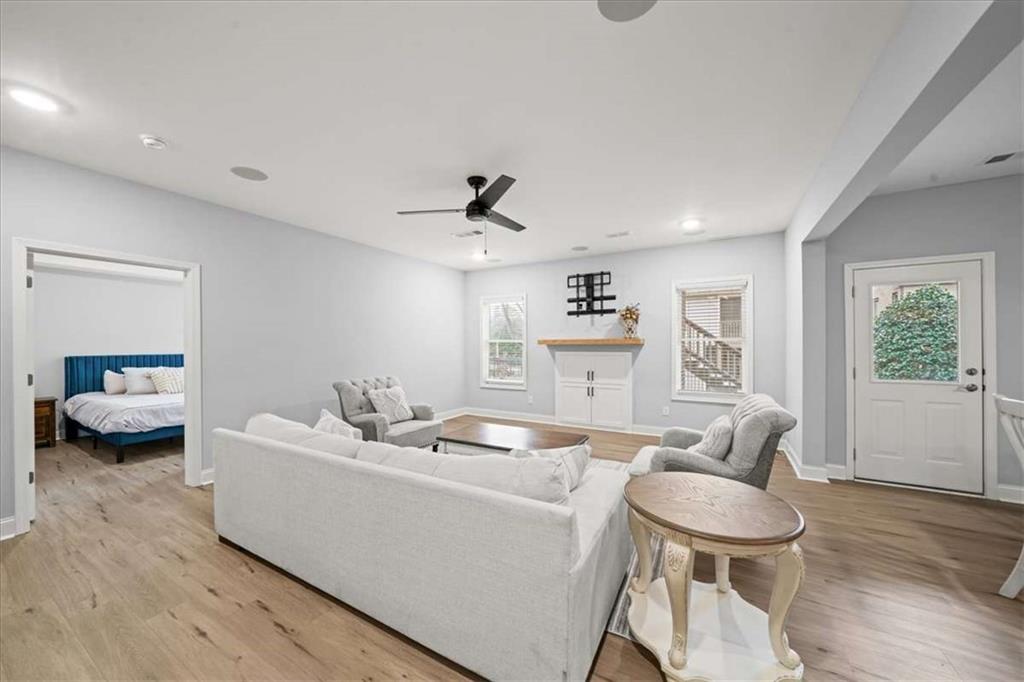 3440 Rialto Place Alpharetta, GA 30022 - Photo 45 of 66 a living room with furniture and a wooden floor