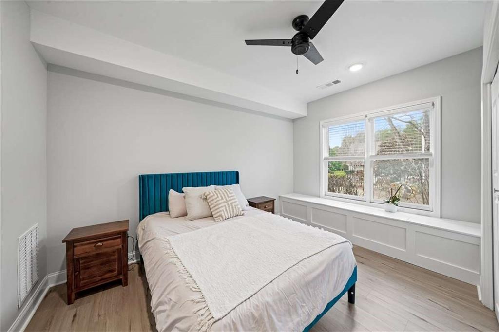 3440 Rialto Place Alpharetta, GA 30022 - Photo 48 of 66 a bedroom with a large bed and a window