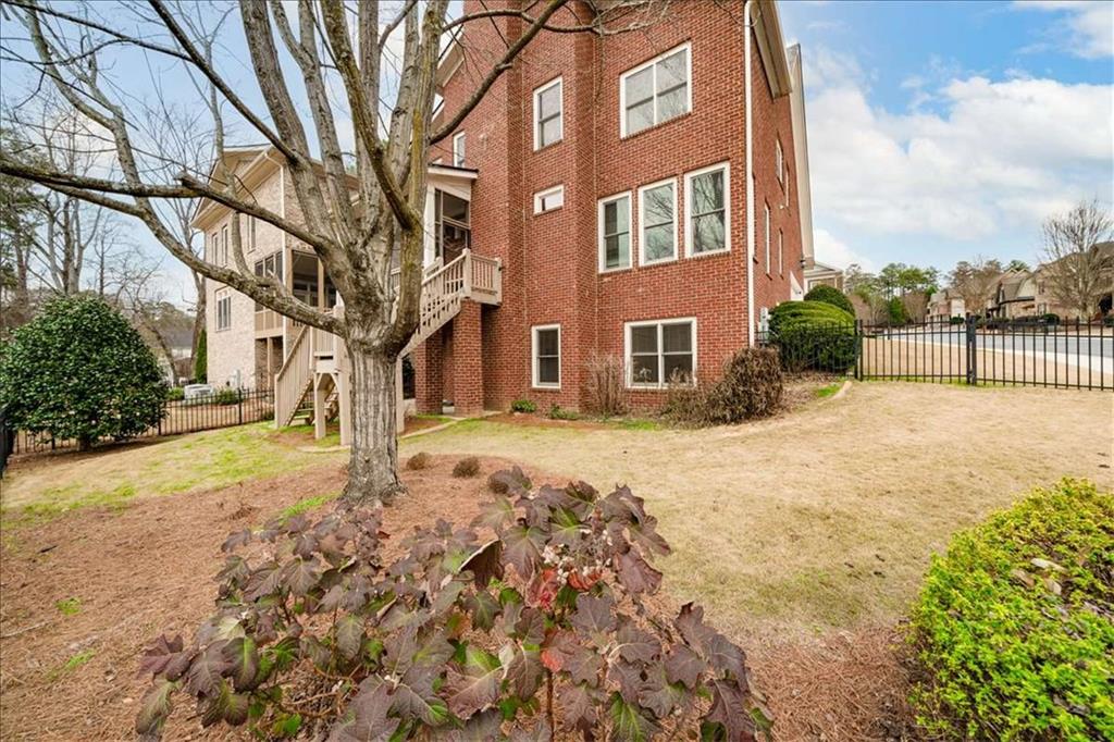 3440 Rialto Place Alpharetta, GA 30022 - Photo 55 of 66 a view of a yard with a house