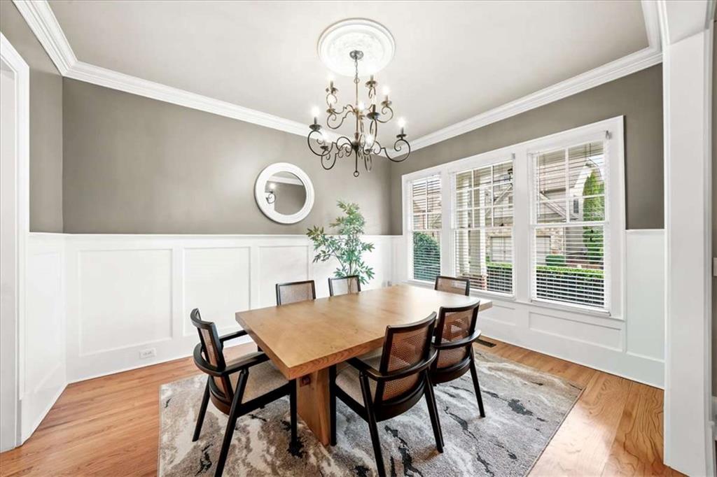3440 Rialto Place Alpharetta, GA 30022 - Photo 10 of 66 a view of a dining room with furniture a chandelier and wooden floor