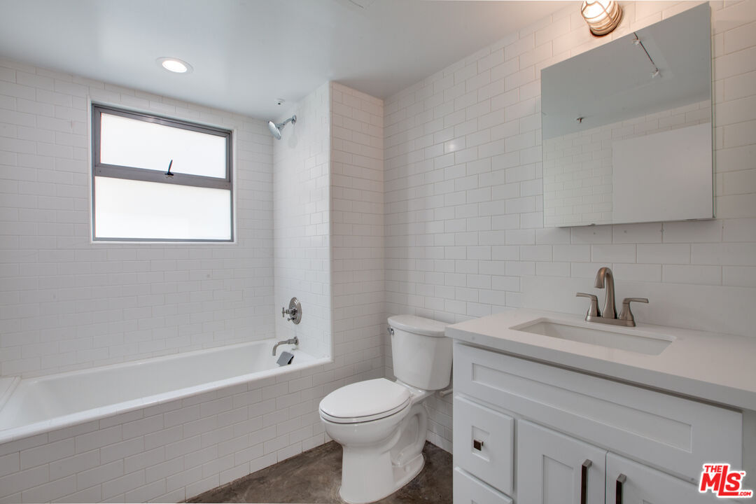 1358 4th Street, Unit PHE Santa Monica, CA 90401 - Photo 20 of 23 a bathroom with a sink toilet and bathtub
