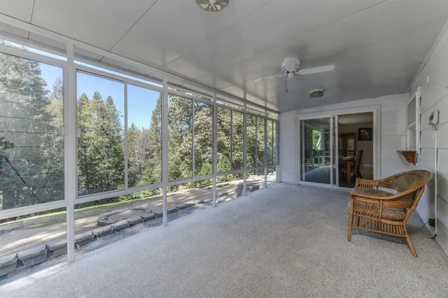 a view of balcony with wooden floor and bench