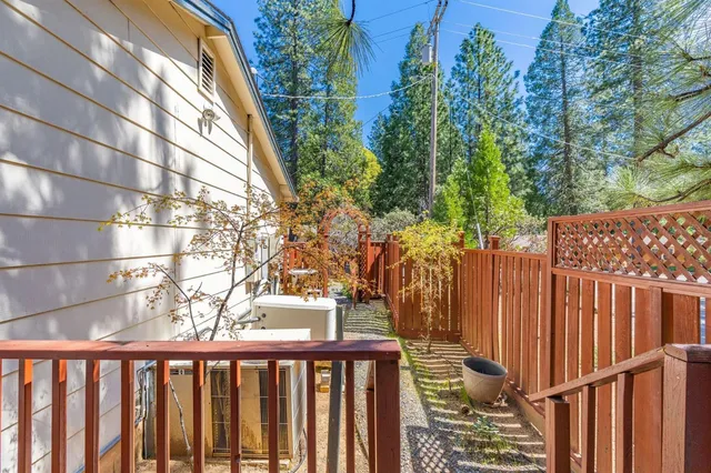 a view of a house with backyard porch and sitting area