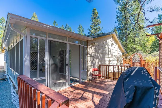 a view of a field with trees in the background