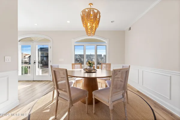a view of a dining room with furniture and window