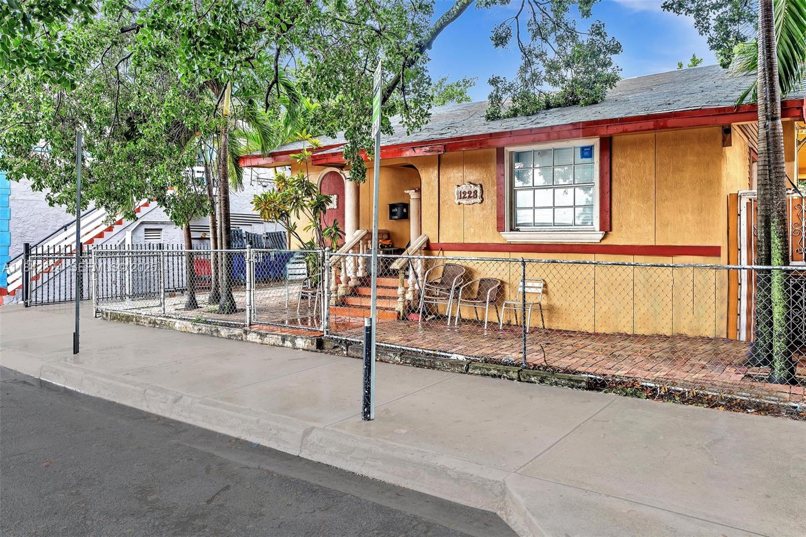 1228 Southwest 2nd Street Miami, FL 33135 - Photo 2 of 18 a view of a house with backyard and sitting area