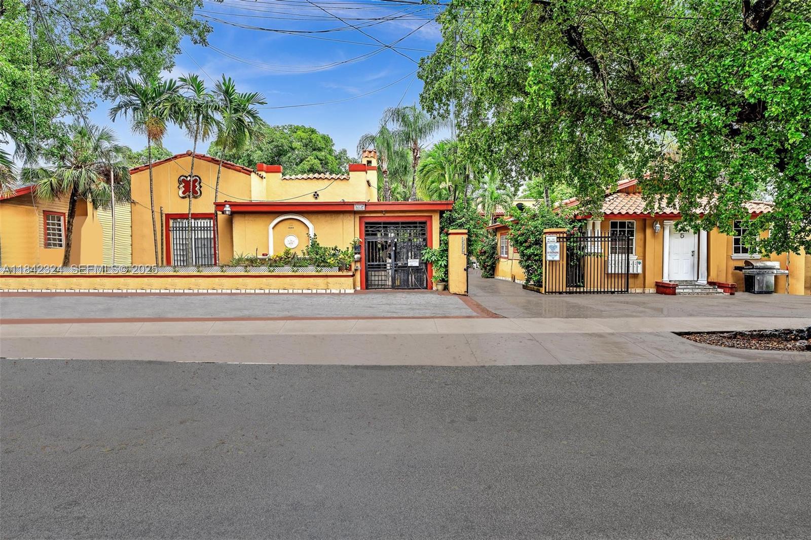 1228 Southwest 2nd Street Miami, FL 33135 - Photo 3 of 18 front view of a house with a street