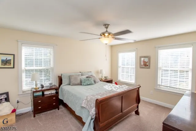 a bed room with a bed and a window