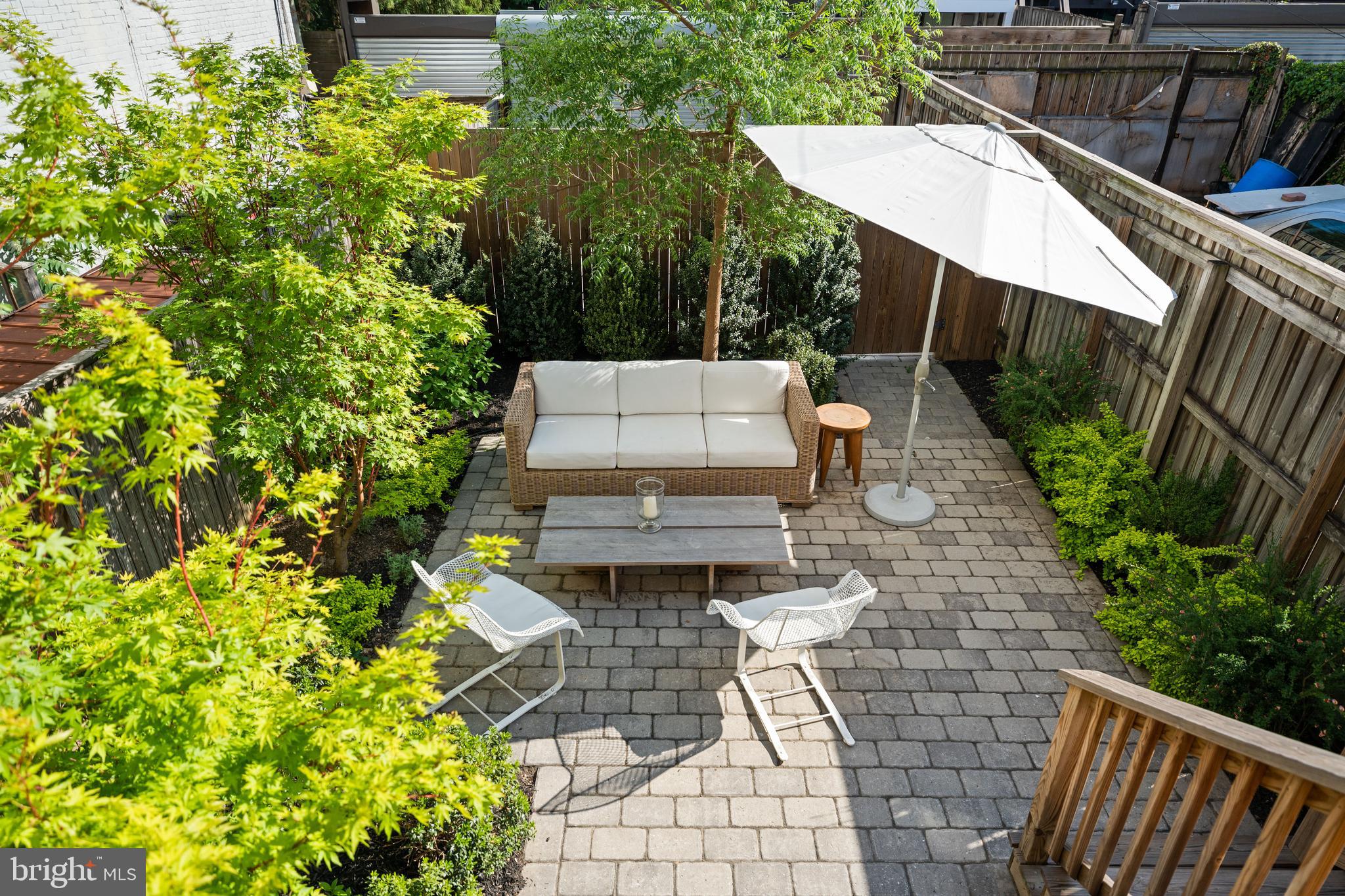 1304 S Street Northwest Washington, DC 20009 - Photo 5 of 23 a view of a patio with table and chairs and potted plants