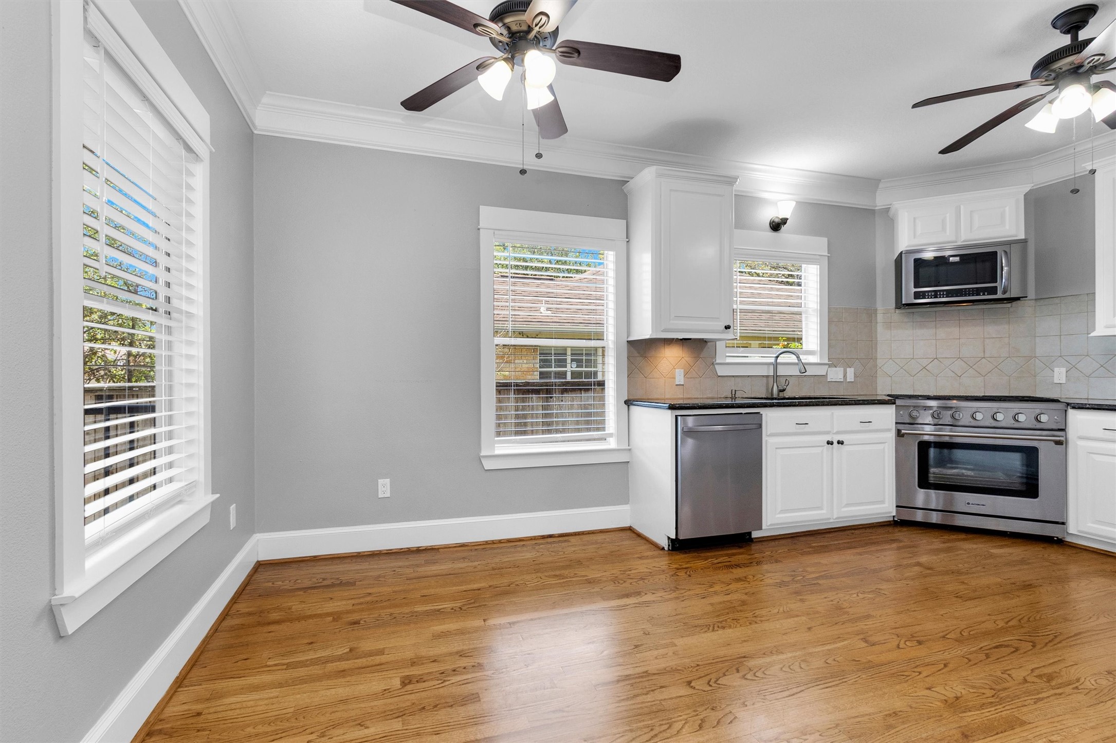 304 Vincent Street Houston, TX 77009 - Photo 15 of 36 a kitchen with a stove and a microwave oven