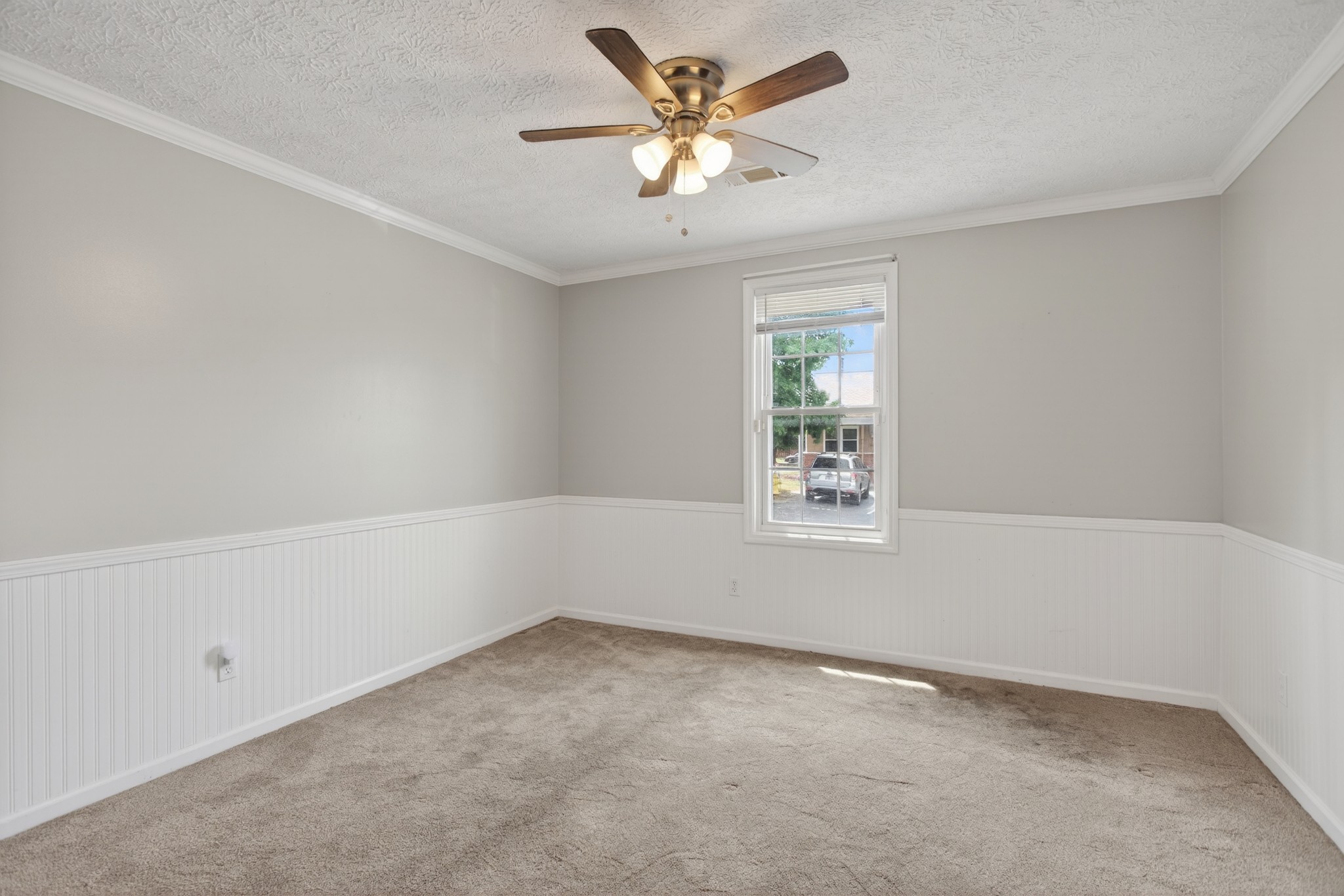 430 Walton Ferry Road, Unit 200 Hendersonville, TN 37075 - Photo 11 of 16 an empty room with a window and a ceiling fan