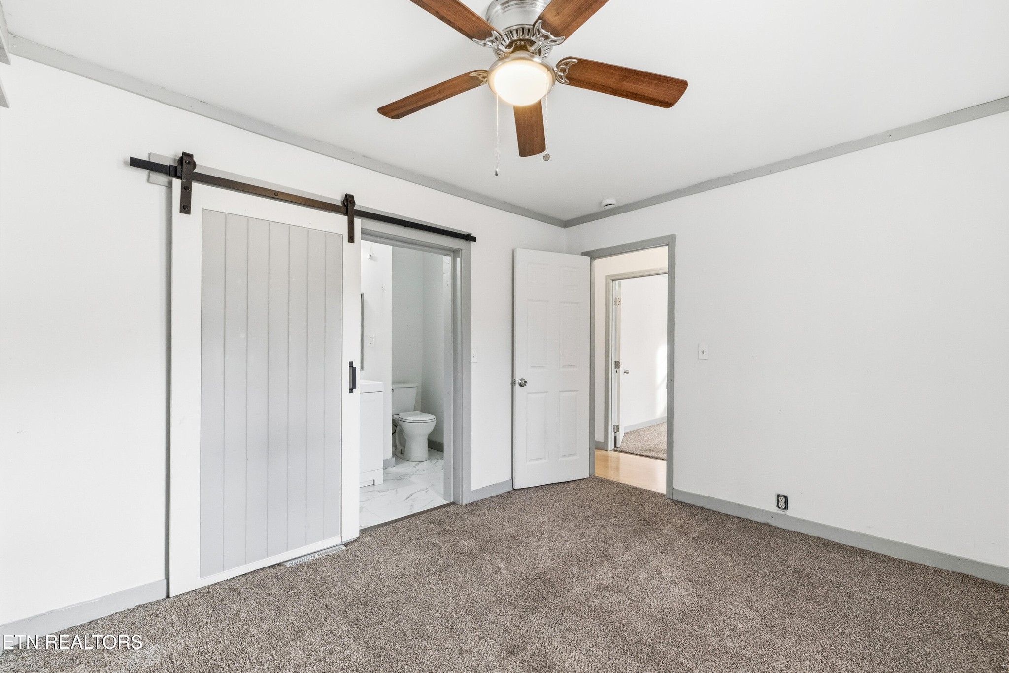 2438 Southside Road Knoxville, TN 37920 - Photo 14 of 21 a view of an empty room with a ceiling fan