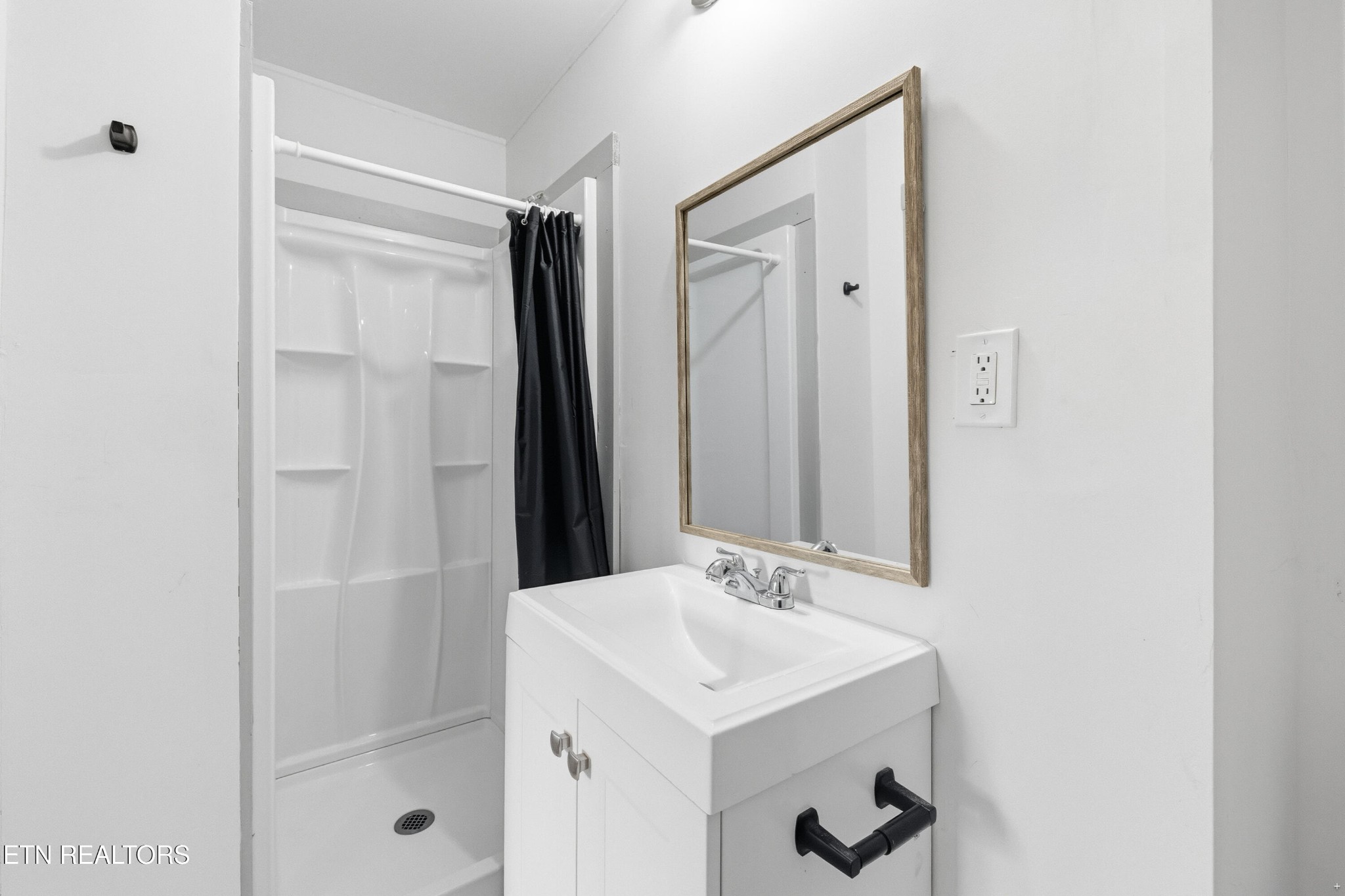 2438 Southside Road Knoxville, TN 37920 - Photo 15 of 21 a bathroom with a sink and a mirror
