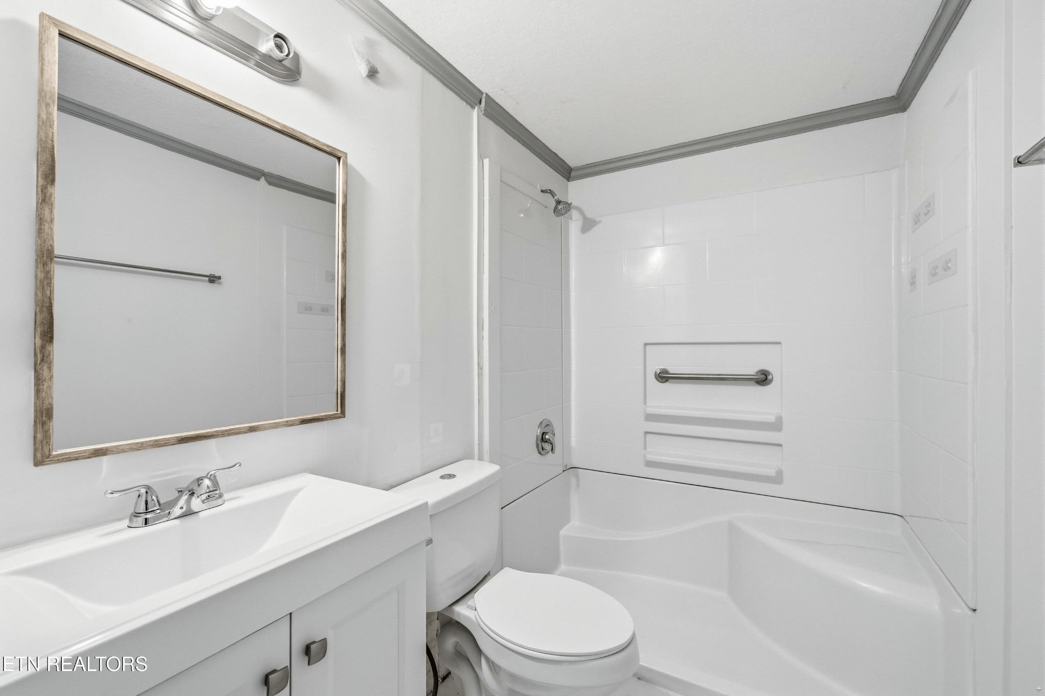 2438 Southside Road Knoxville, TN 37920 - Photo 18 of 21 a bathroom with a bathtub shower sink vanity mirror and toilet